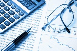 financial documents and calculator